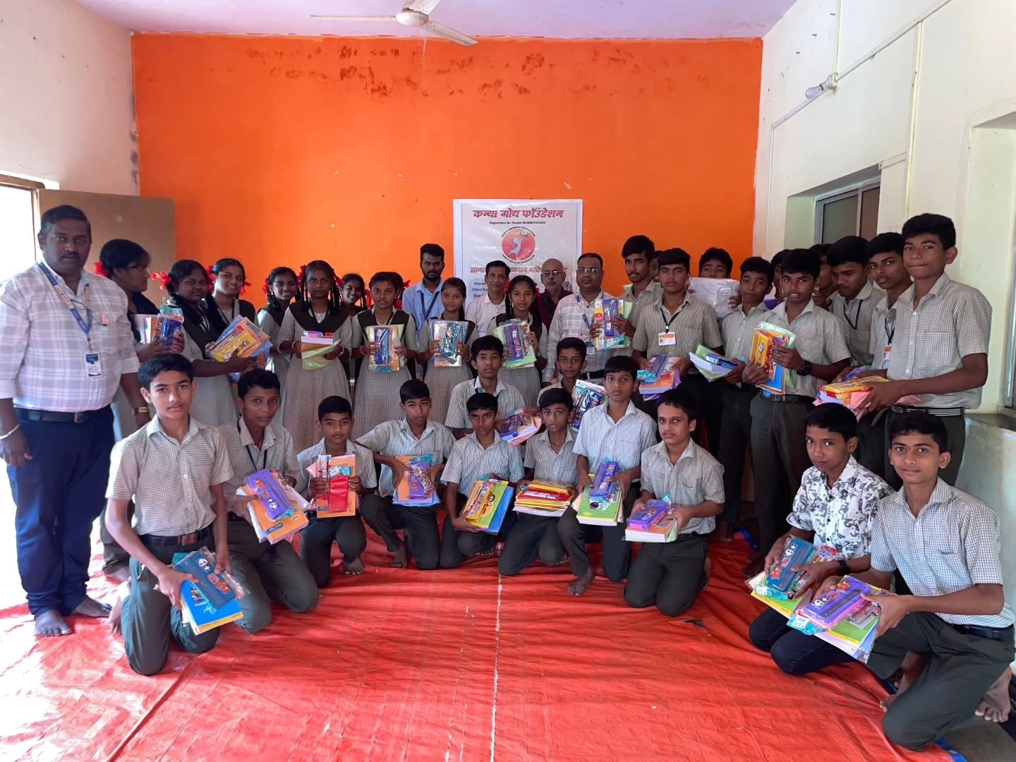 Full group of students with kits at school