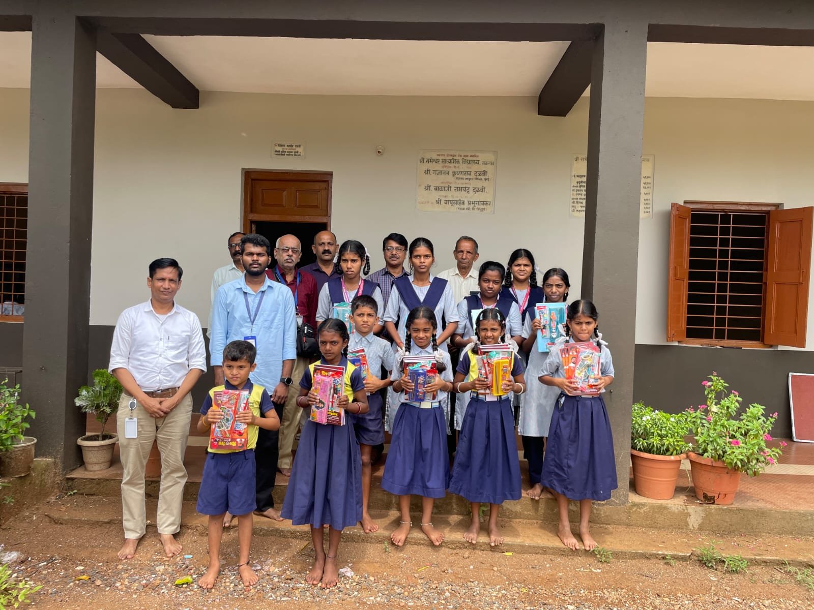 Children with school kits at a school in Konkan